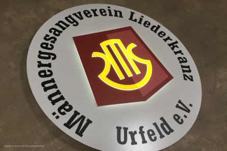 Runder Leuchtkasten mit dekupiertem Logo