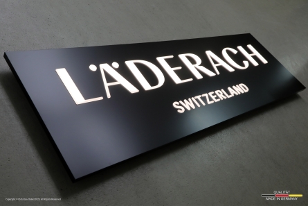 LÄDERACH SWITZERLAND - Lichtwerbung mit durchgesteckten Leuchtbuchstaben
